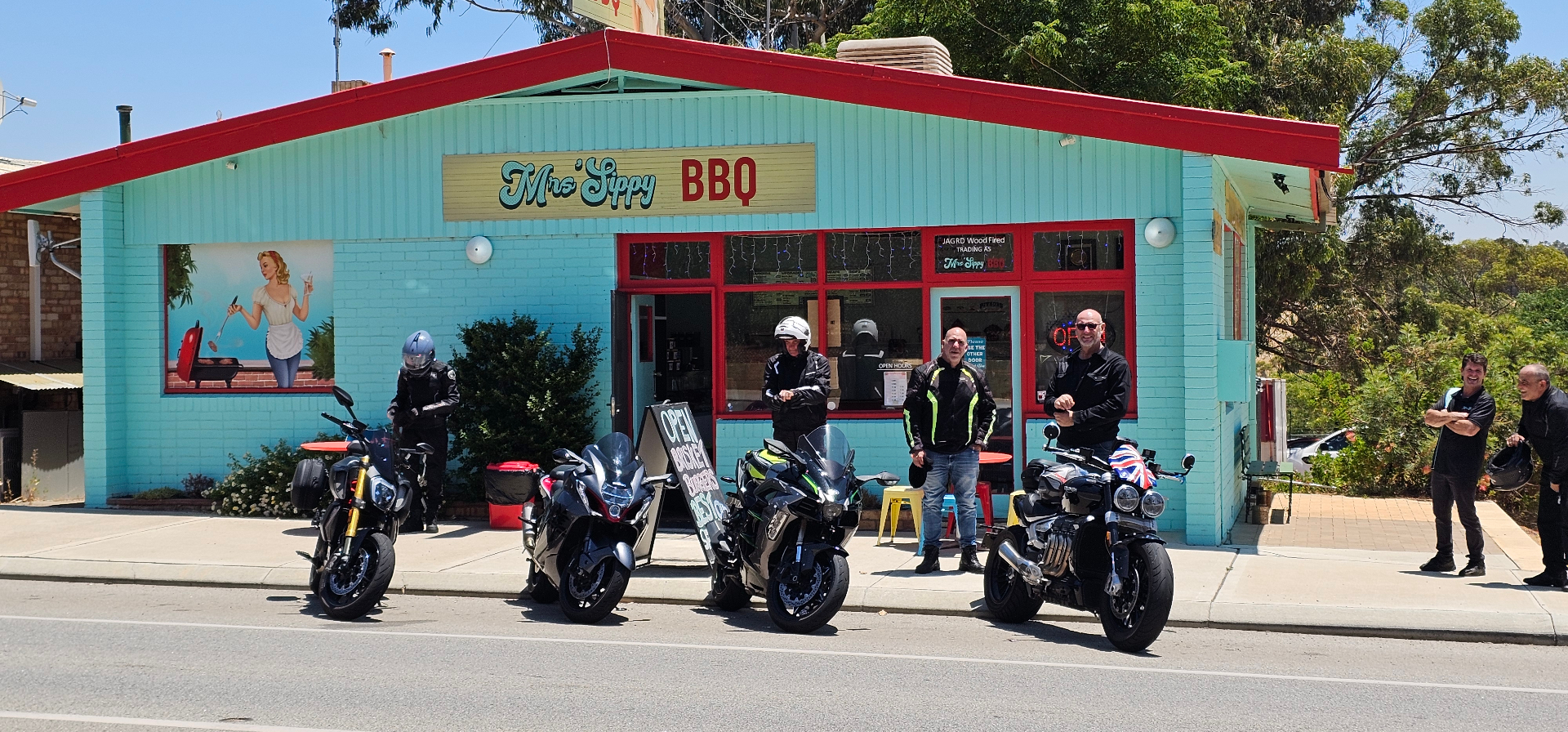 Mrs'Sippy BBQ storefront with motorcycles out front